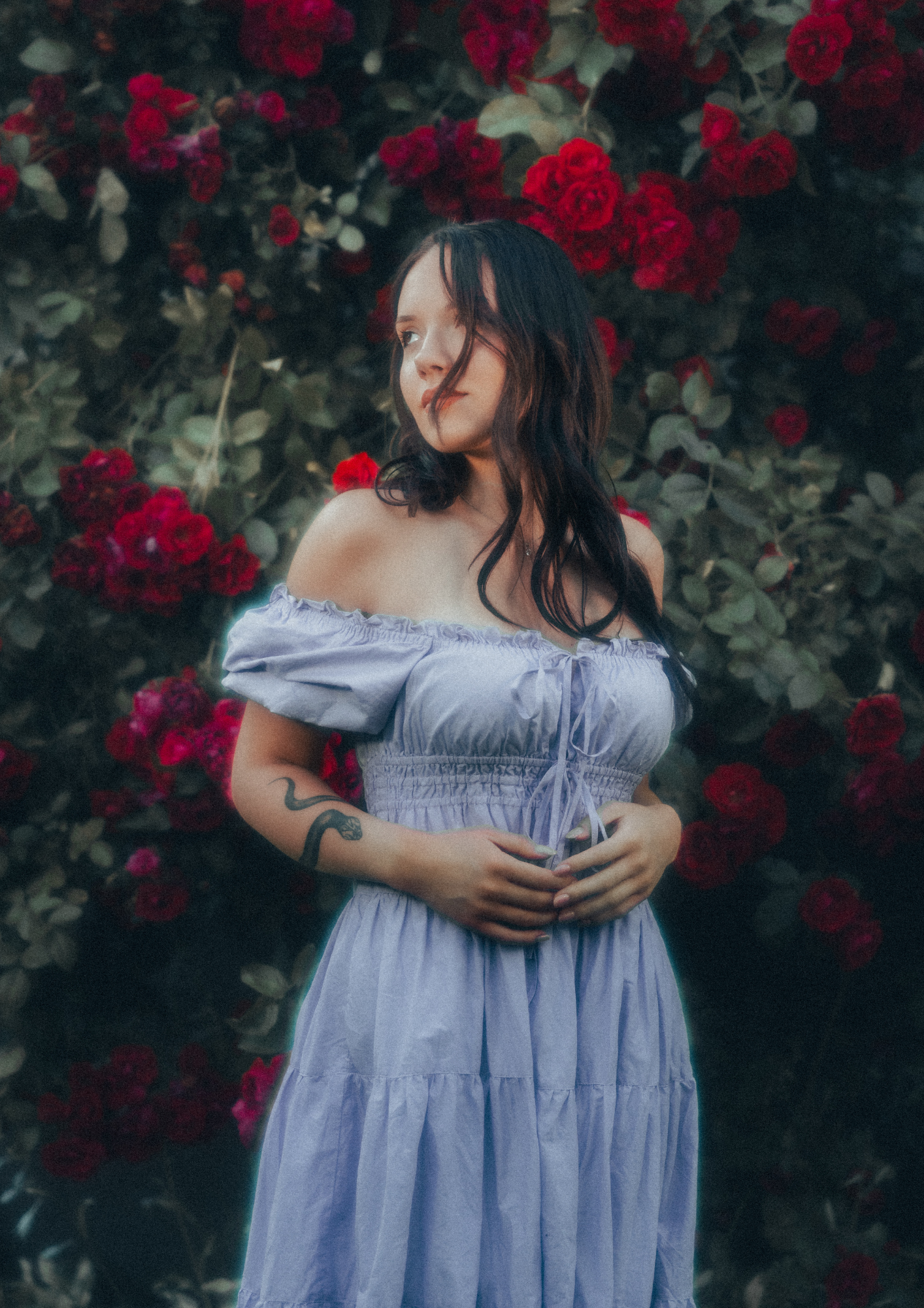 MODEL WEARS ERAVELA PENELOPE MIDI DRESS LILAC IN ENCHANTED ROSE GARDEN