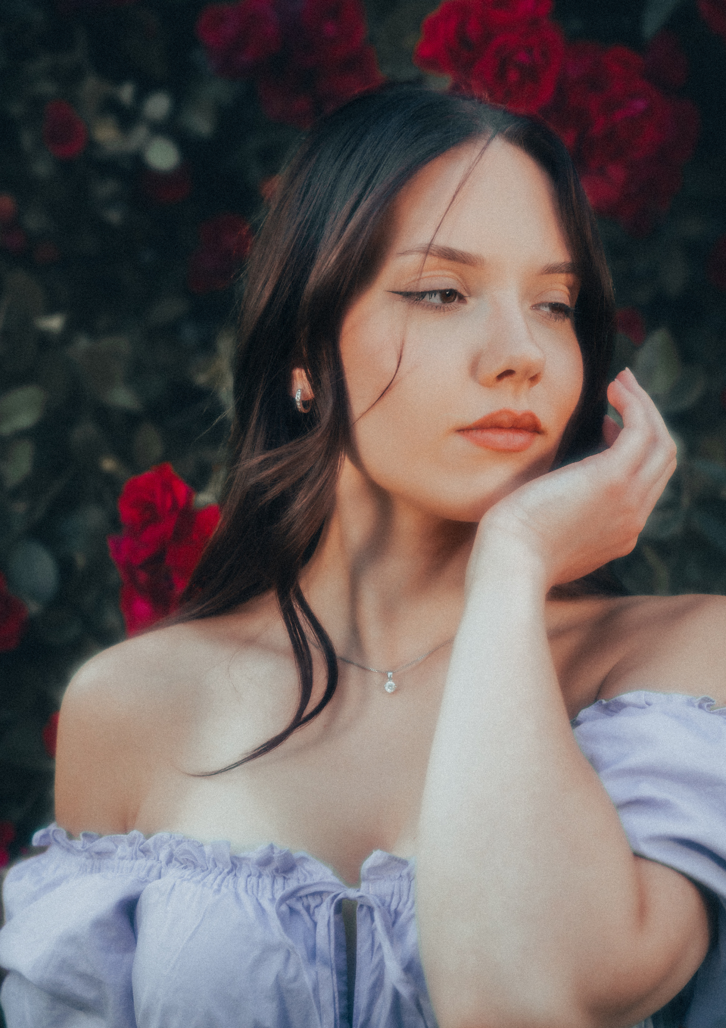 MODEL WEARS ERAVELA PENELOPE MIDI DRESS LILAC IN ENCHANTED ROSE GARDEN